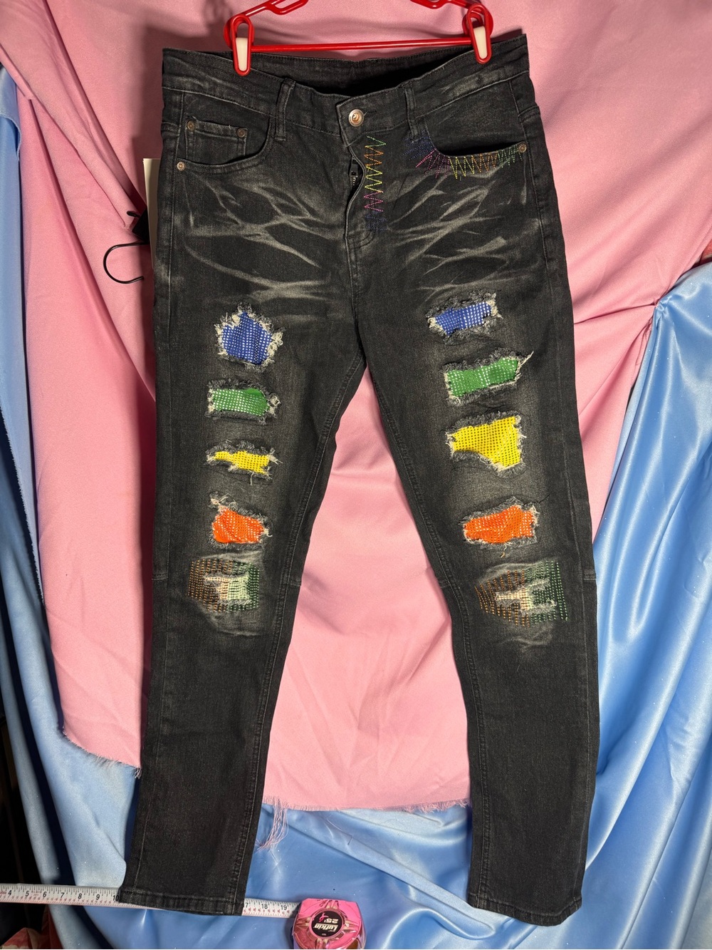 Men's Black Distressed Jeans with Multicolor Patch Accents